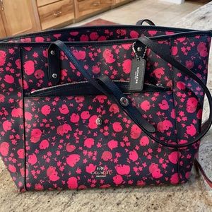 Coach purse with roses and flowers.